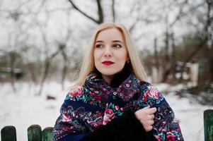 Blonde girl with hand embroidered scarf posed at winter day. Women's handkerchief. photo