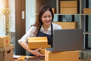 Businesswoman checking online for delivery to customers. photo