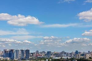 Cityscape with new high rise residential buildings under a summer cloudy sky. photo