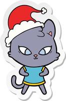 cute sticker cartoon of a cat wearing santa hat vector