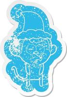 cartoon distressed sticker of a hooting monkey wearing santa hat vector