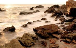 Beautiful seascape. Sea and rock at the sunset photo