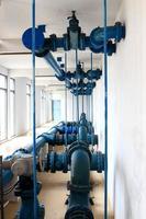 Water pumping station, industrial interior and pipes photo