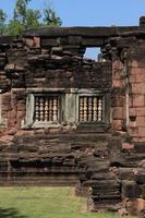 Sand stone window of the historical castle in Thailand. photo