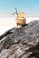 Coconut cocktail on the beach photo