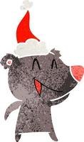 laughing bear retro cartoon of a wearing santa hat vector