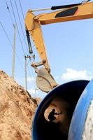 Specialized equipment for placing large diameter pipe in a trench photo