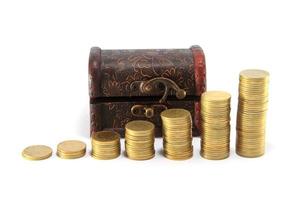 A wooden ancient chest full of money photo