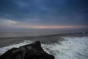 Blue wave at sunset Bali Beach ,Indonesia photo