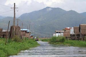 stilt house on lake photo