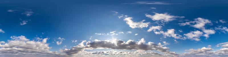 Seamless hdri panorama 360 degrees angle view blue sky with beautiful cumulus clouds with zenith for use in 3d graphics or game development as sky dome or edit drone shot photo