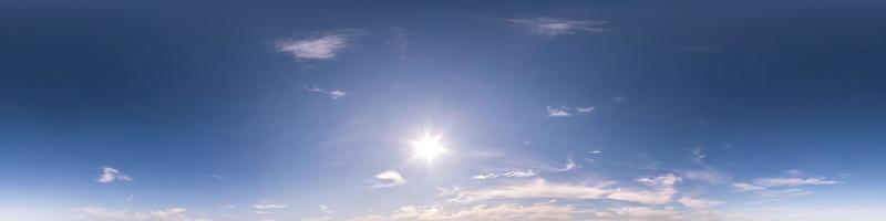 blue sky with beautiful fluffy cumulus clouds. Seamless hdri panorama 360 degrees angle view without ground for use in 3d graphics or game development as sky dome or edit drone shot photo