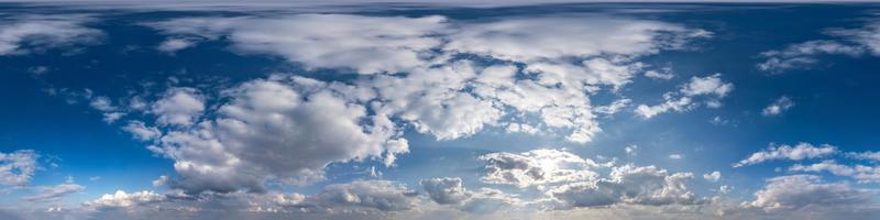 Seamless hdri panorama 360 degrees angle view blue sky with beautiful fluffy cumulus clouds with zenith for use in 3d graphics or game development as sky dome or edit drone shot photo