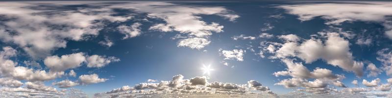 Seamless hdri panorama 360 degrees angle view blue sky with beautiful cumulus clouds with zenith for use in 3d graphics or game development as sky dome or edit drone shot photo