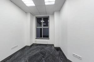 big windows in empty unfurnished room interior in white style color in modern apartments,  office or clinic photo