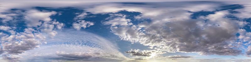 Seamless hdri panorama 360 degrees angle view blue sky with beautiful evening fluffy cumulus clouds without ground with zenith for use in 3d graphics or game development as sky dome or edit drone shot photo