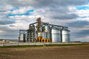 Granary elevator. agro-processing and manufacturing plant for processing and silver silos for drying cleaning and storage of agricultural products, flour, cereals and grain. photo