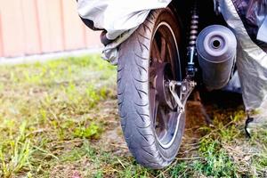 motorcycle rear wheel and exhaust pipe photo