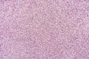 Close up surface of texture of small stone or sand wall background photo