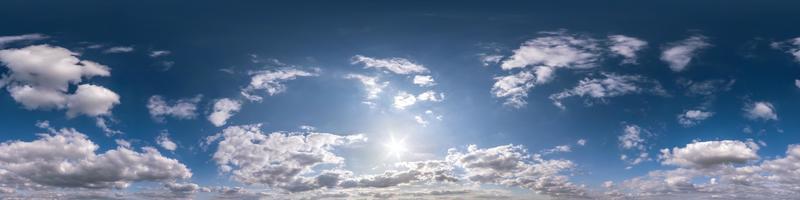 blue sky with beautiful fluffy cumulus clouds without ground. Seamless hdri panorama 360 degrees angle view without ground for use in 3d graphics or game development as sky dome or edit drone shot photo