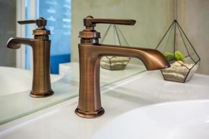 copper water tap sink with faucet in expensive loft bathroom photo