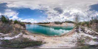 full seamless spherical hdri panorama 360 degrees angle view on limestone coast of huge green lake for sand extraction old mining with beautiful clouds in equirectangular projection, VR content photo