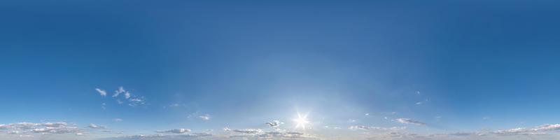 blue sky with beautiful fluffy cumulus clouds. Seamless hdri panorama 360 degrees angle view without ground for use in 3d graphics or game development as sky dome or edit drone shot photo