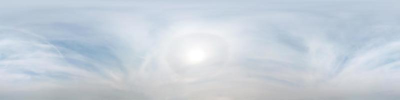 clear blue sky with halo sun. Seamless hdri panorama 360 degrees angle view with zenith for use in 3d graphics or game development as sky dome or edit drone shot photo