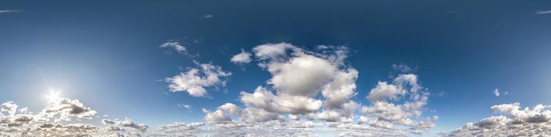 Seamless hdri panorama 360 degrees angle view blue sky with beautiful cumulus clouds with zenith for use in 3d graphics or game development as sky dome or edit drone shot photo