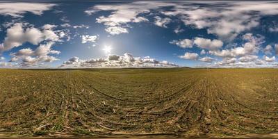 full seamless spherical hdri panorama 360 degrees angle view among fields in spring day with awesome clouds in equirectangular projection, ready for VR AR virtual reality content photo