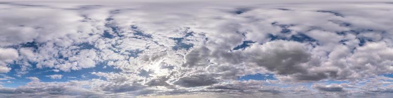 Seamless hdri panorama 360 degrees angle view blue sky with beautiful fluffy cumulus clouds with zenith for use in 3d graphics or game development as sky dome or edit drone shot photo