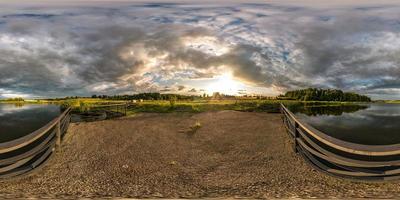 full seamless spherical hdri panorama 360 degrees angle view on concrete pier near lake in evening in equirectangular projection with zenith, ready VR AR virtual reality content photo