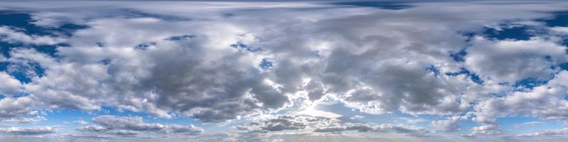 Seamless hdri panorama 360 degrees angle view blue overcast sky with beautiful fluffy cumulus clouds without ground for use in 3d graphics or game development as sky dome or edit drone shot photo