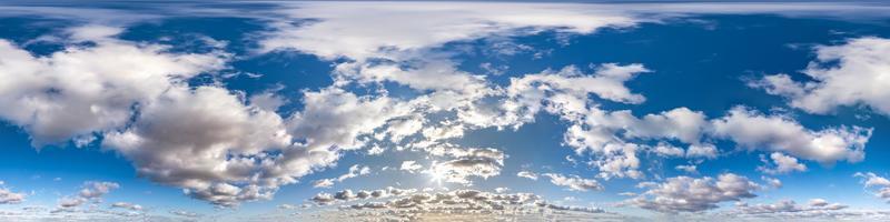 Seamless hdri panorama 360 degrees angle view blue sky with beautiful cumulus clouds with zenith for use in 3d graphics or game development as sky dome or edit drone shot photo
