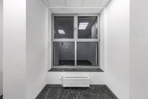 big windows in empty unfurnished room interior in white style color in modern apartments,  office or clinic photo