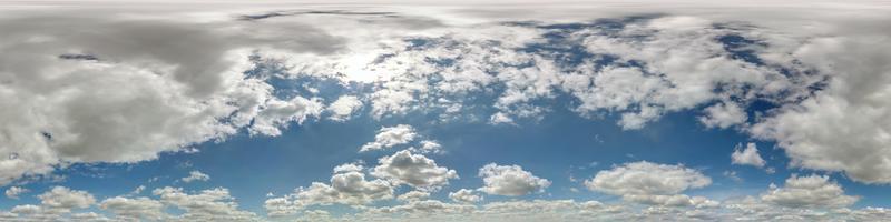 blue sky hdr 360 panorama with white beautiful clouds in seamless projection with zenith for use in 3d graphics or game development as sky dome or edit drone shot for sky replacement photo