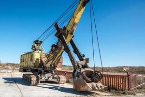 huge old rusty abandoned mining excavator photo