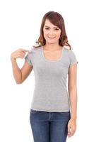 happy teenage girl in blank gray t-shirt on white background photo