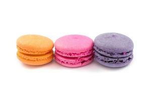 Colorful macaroons variety closeup on white background photo