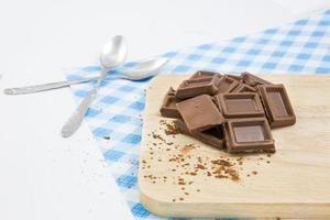 Group of chocolate candy isolated on wood. concept photo