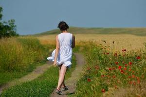 Young happy woman in green field photo