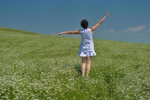 Young happy woman in green field photo