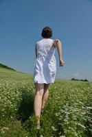 Young happy woman in green field photo