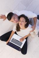 couple using tablet and laptop computers top view photo