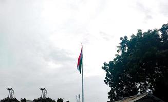 Waving Flag of India in Blue Sky photo