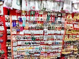 Colorful Indian latest woman fashion artificial jewlery,in retail shop or store in display photo