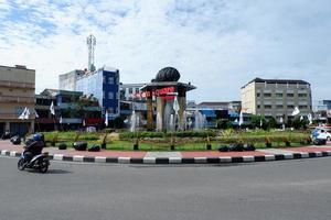 Papua, Indonesia - October 16, 2021. Street view with passing vehicles photo