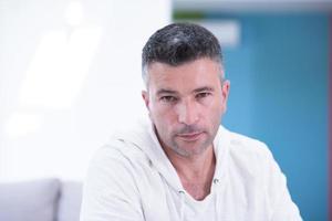 Portrait of a young man at home photo