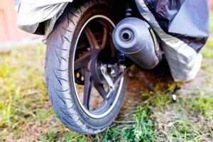 motorcycle rear wheel and exhaust pipe photo