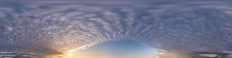 Seamless hdri panorama 360 degrees angle view blue sky with beautiful evening fluffy cumulus clouds without ground with zenith for use in 3d graphics or game development as sky dome or edit drone shot photo